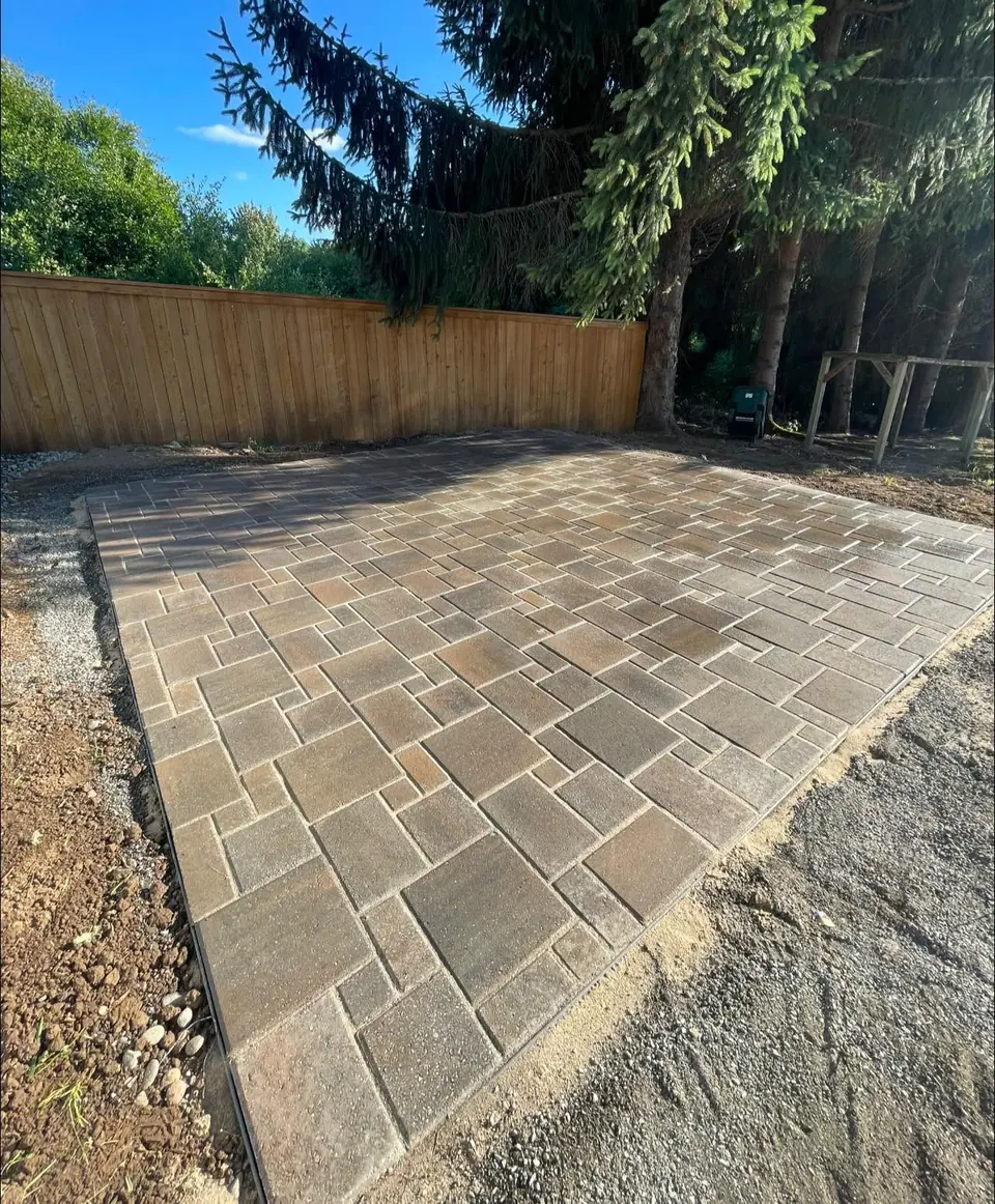 Completed paver patio in a fenced Clark County backyard