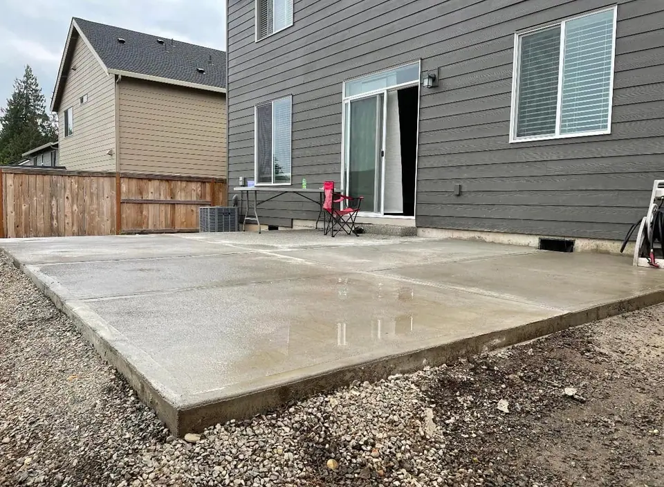 Freshly poured and floated concrete patio slab behind a Vancouver home