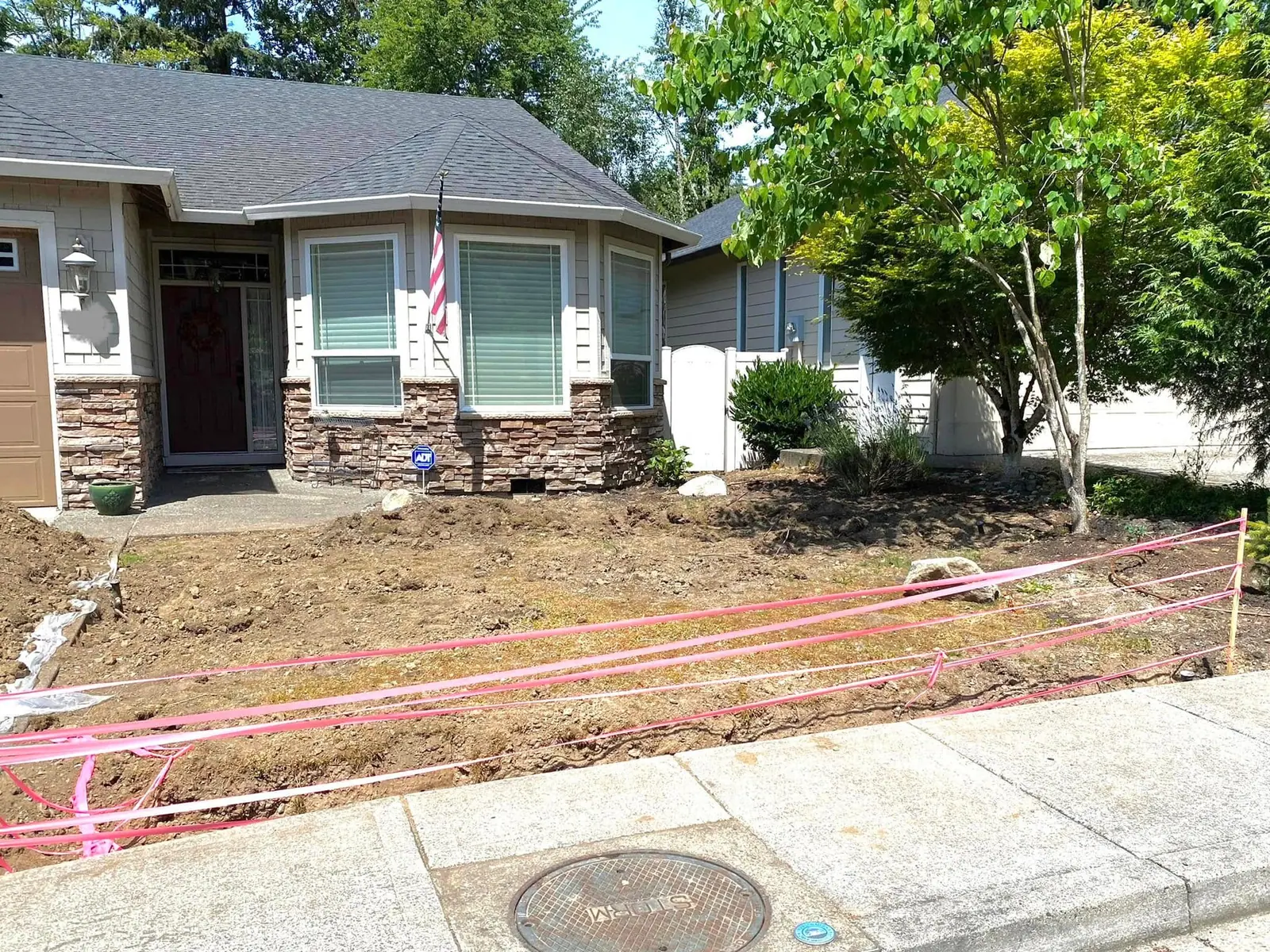 Front yard stripped and staged during a full landscape renovation