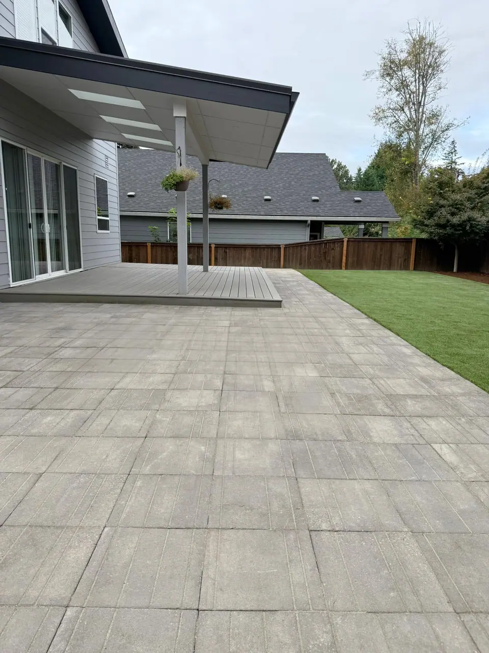 Paver patio and lawn behind a contemporary Clark County home