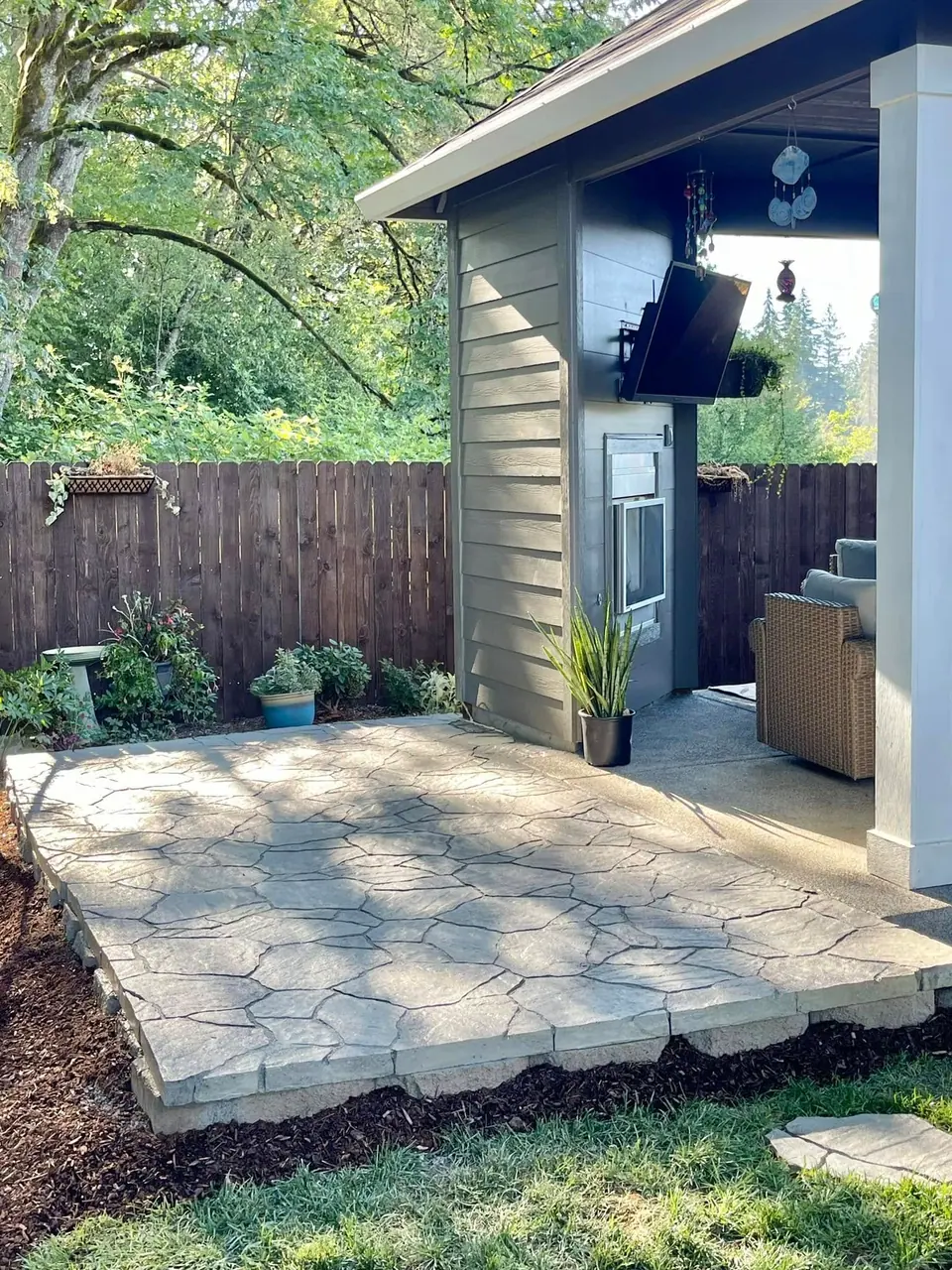 Paver patio with a built-in outdoor kitchen and grill station